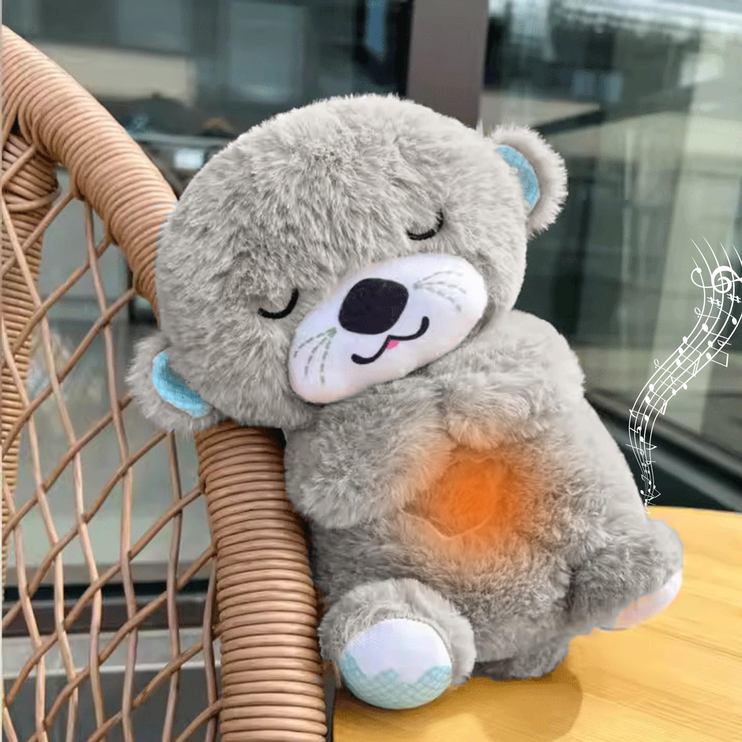 Gray plush toy with a heart light on a chair