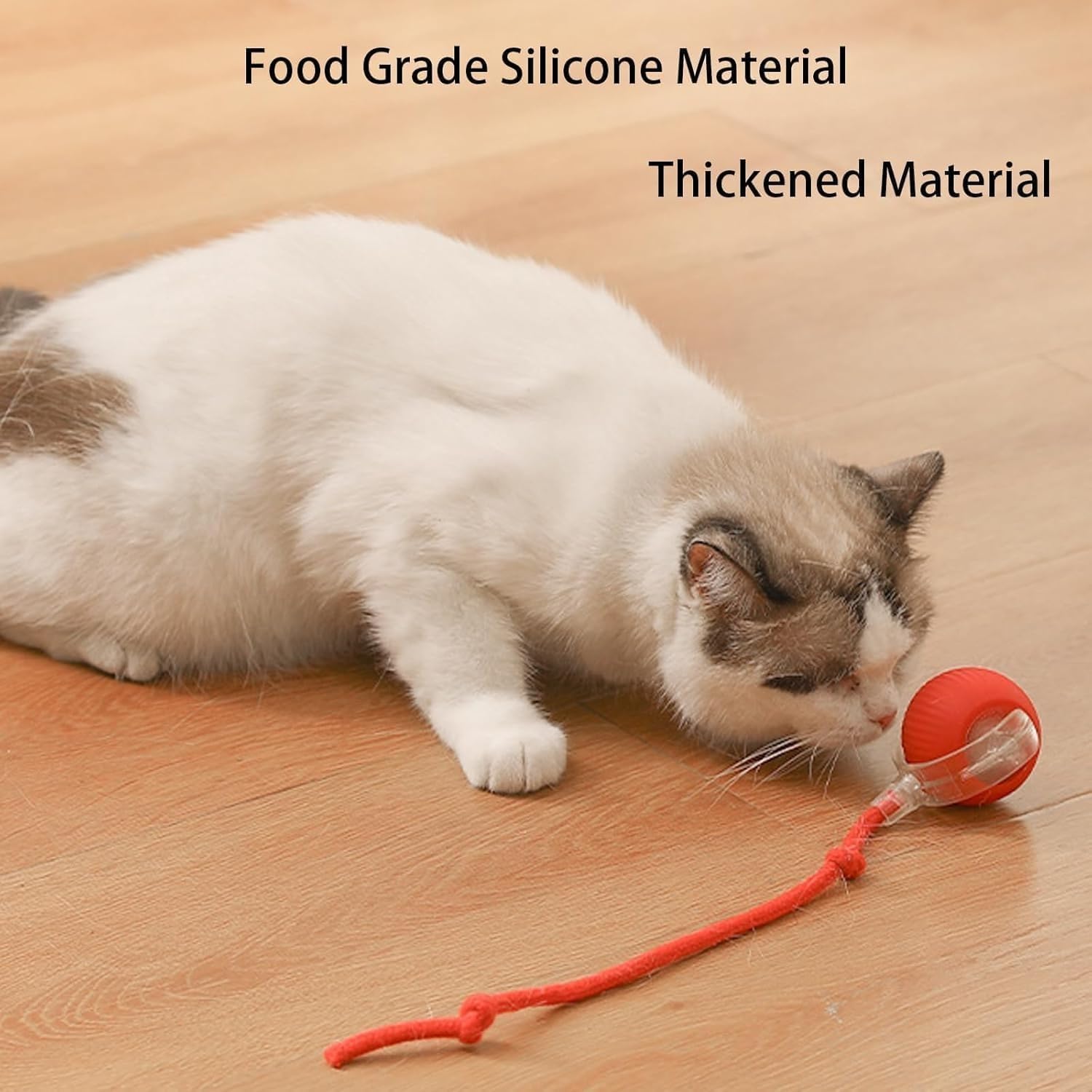 Cat playing with a red ball toy on a wooden floor, with text about material quality.
