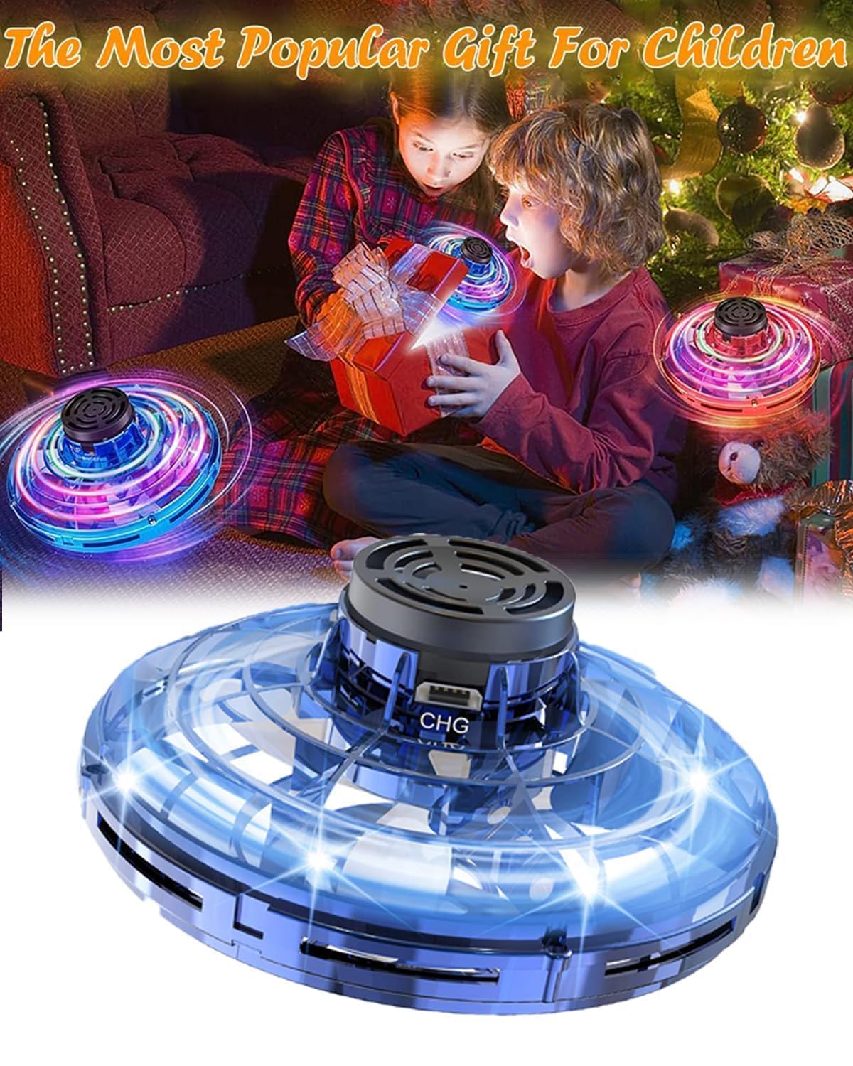 Children playing with a glowing toy disc in front of a Christmas tree.