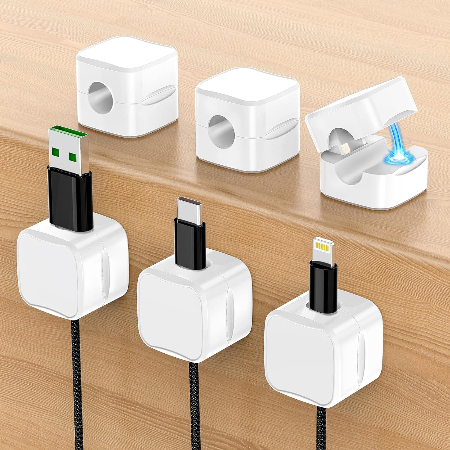 Set of white cable organizers with different connectors on a wooden surface