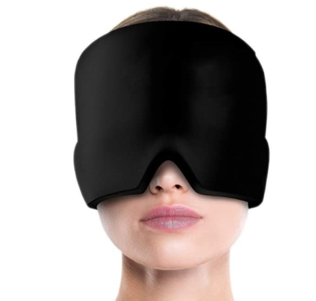 Black sleep mask worn by a person on a white background